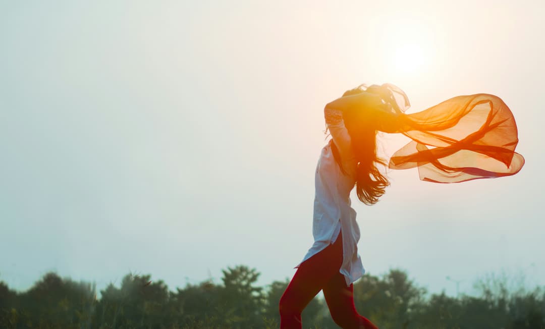 Woman spreading hair during sunset Woman spreading hair during sunset