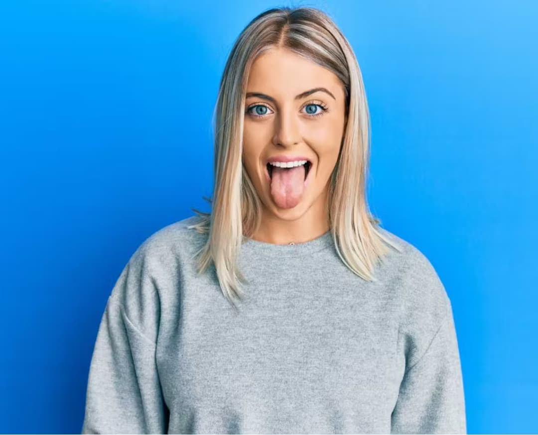 Girl with her tongue out Girl with her tongue out