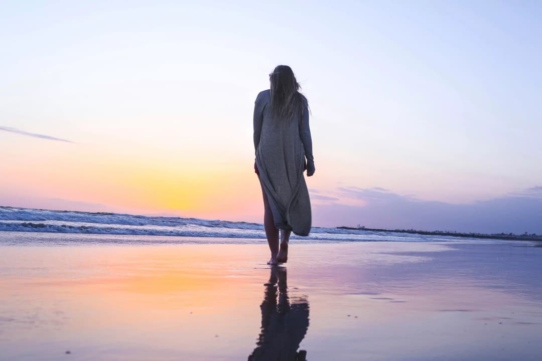 woman standing on beachfront woman standing on beachfront